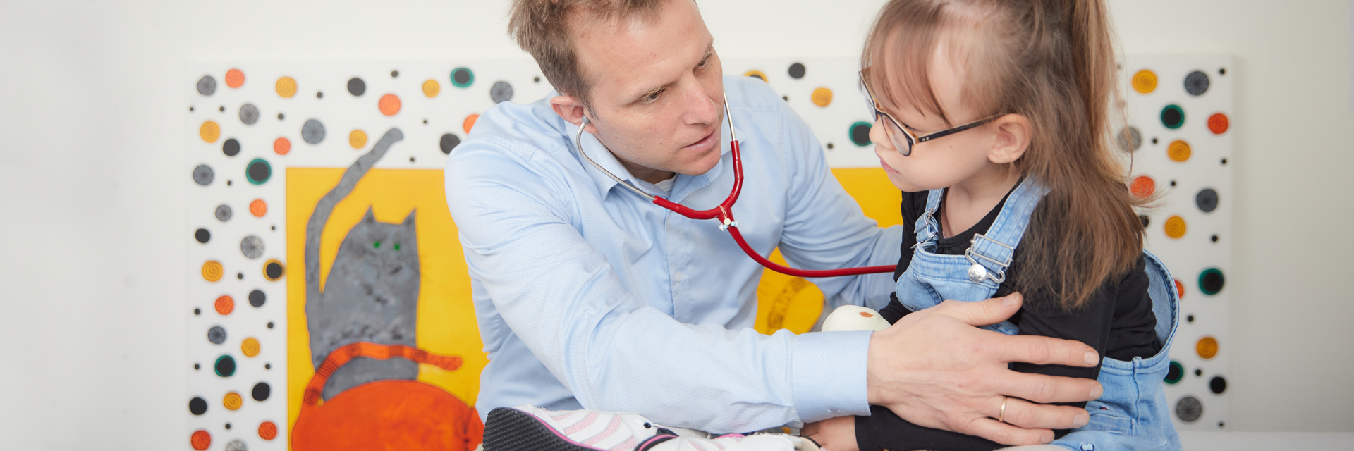 Picture: A doctor at the paediatric clinic examines the breathing of a small patient with a stethoscope.